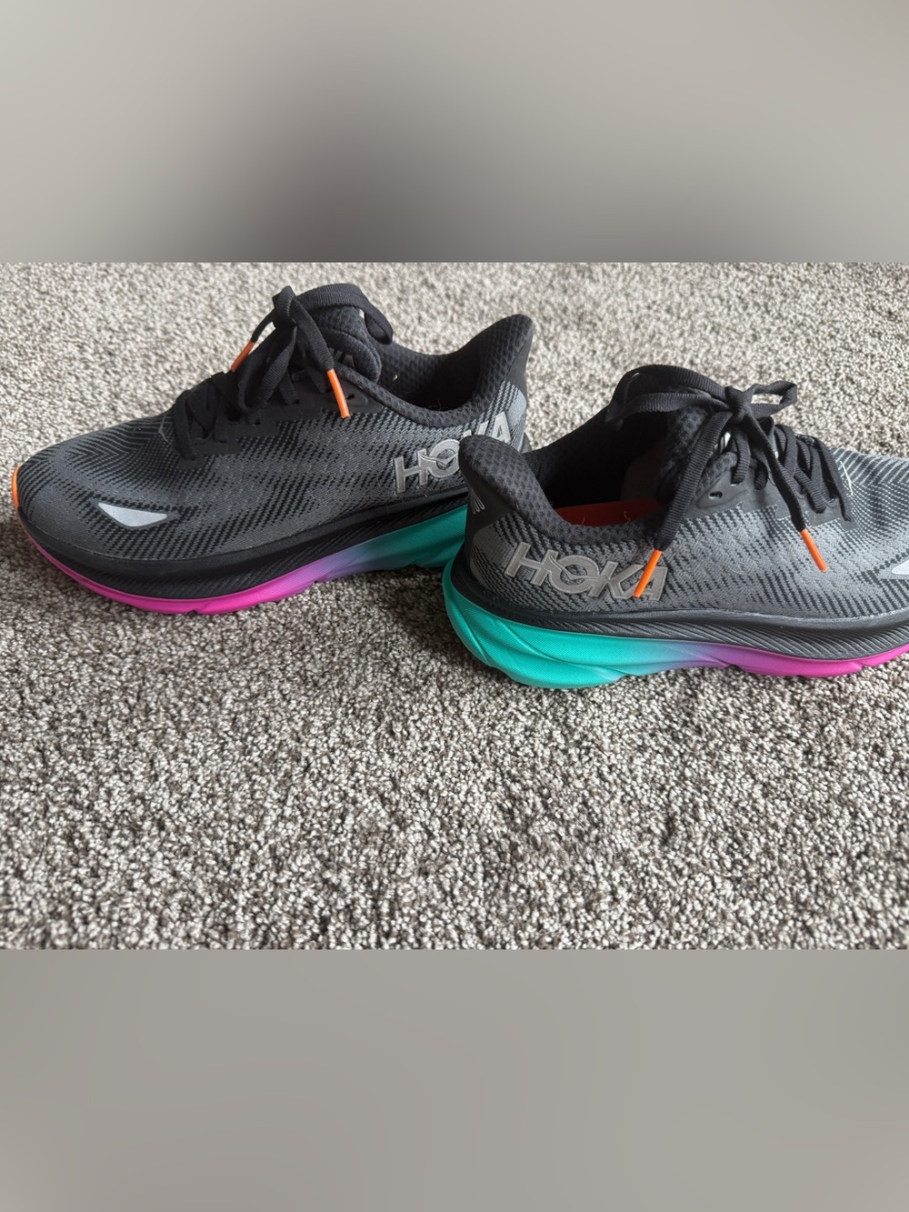 Hoka Black Running Shoes with Teal-to-Purple Gradient Midsole and Orange Accents